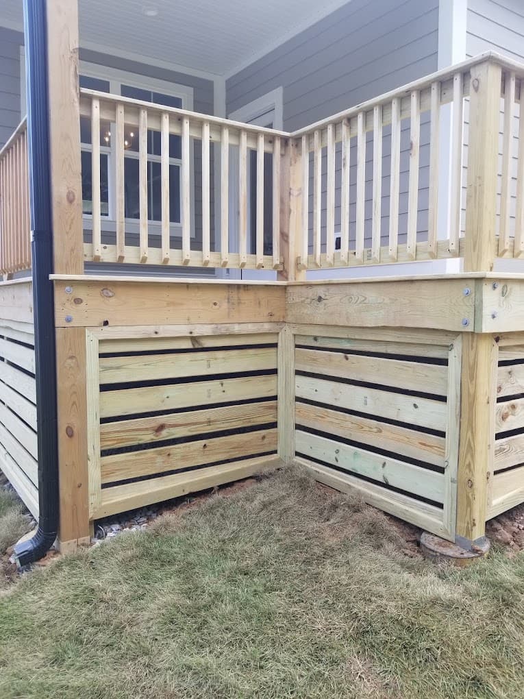 New wood porch with spindle railings and horizontal slat skirting